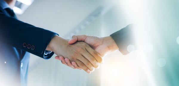 Businessmen Making Handshake With Partner