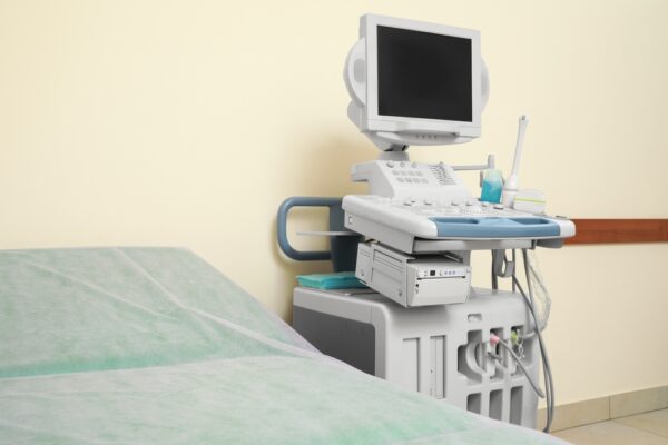 Ultrasound Machine And Examination Table In Hospital